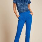 Stylish Woman in Blue Leopard Print Outfit and Accessories