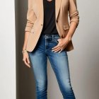 Confident Woman in Stylish Blazer and Fitted Jeans