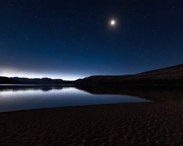Serene Night Landscape with Lake and Crescent Moon