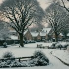 Winter Village Scene with Snow-Covered Houses