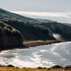 Dramatic Coastal Scene with Cliffs and Waterfalls
