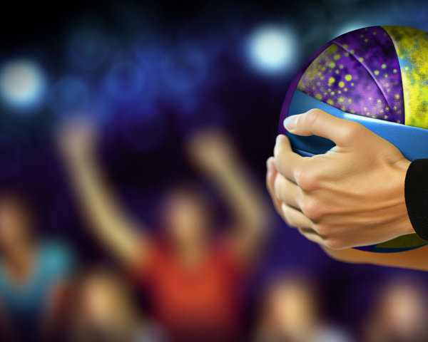 Close-Up of Colorful Basketball with Cheering Crowd