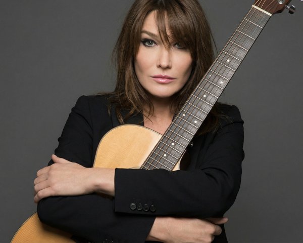 Italian-French Model in Black Jacket with Guitar
