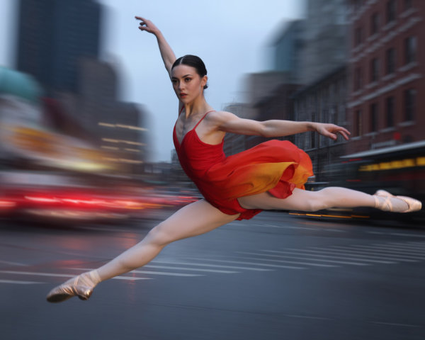 Ballerina Leaping in Red and Orange Dress in City