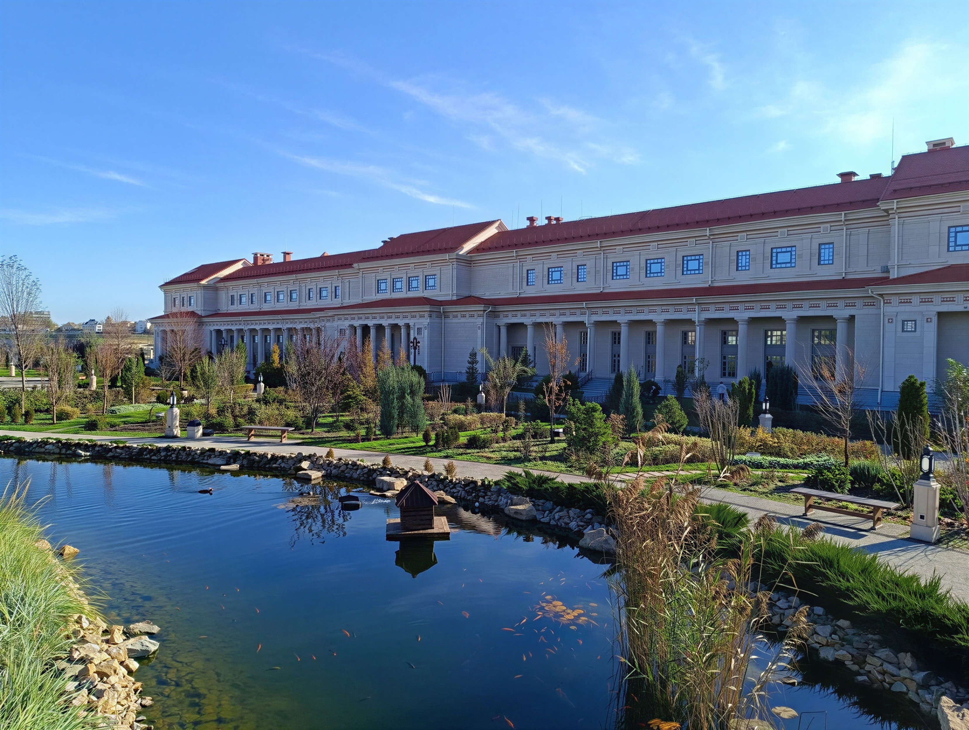 Serene Garden Landscape with Tranquil Pond and Architecture