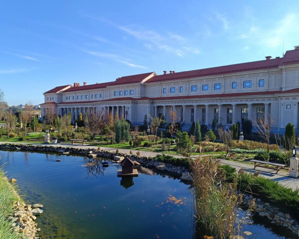 Serene Garden Landscape with Tranquil Pond and Architecture