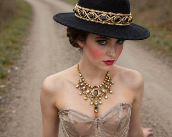 Portrait of a woman with fair skin and jewelry details