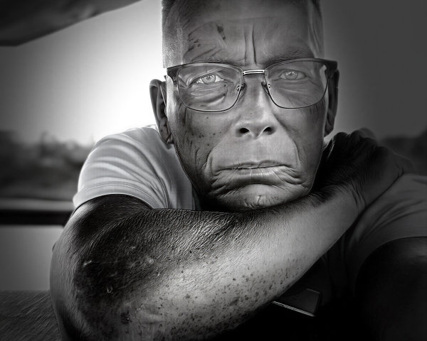 Close-up of an expressive aged face in black and white