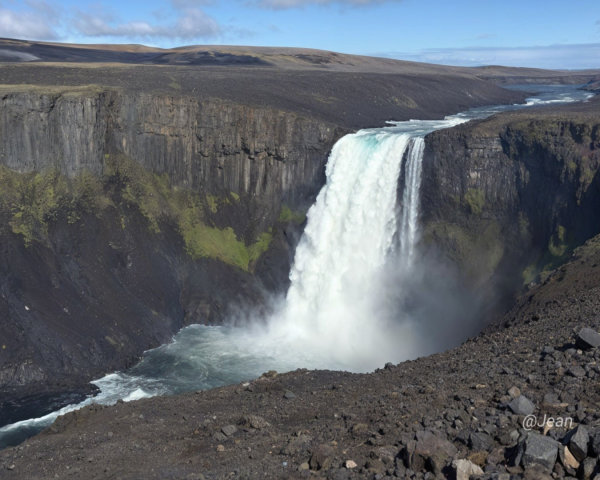 Majestic Waterfall in Rugged Canyon Landscape