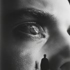 Close-Up of Eye Reflecting Distant Figure Walking