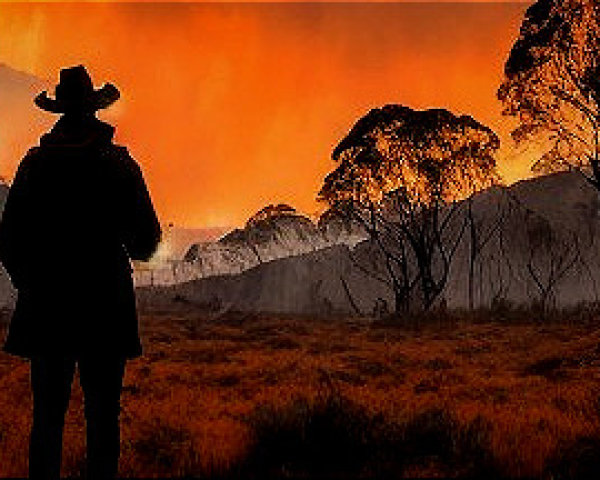 Silhouetted Figure Against Dramatic Sunset Colors