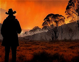 Silhouetted Figure Against Dramatic Sunset Colors