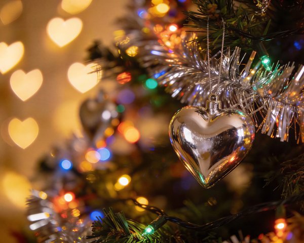 Silver Heart Ornament on a Christmas Tree Close-Up