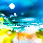 Portrait of a woman with bold makeup and cosmic backdrop
