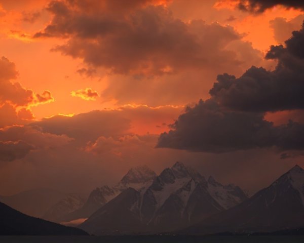 Vibrant Sunset Over Snow-Capped Mountains Landscape