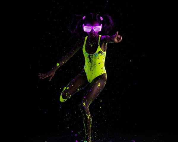 Child in Neon Swimsuit with Colorful Background