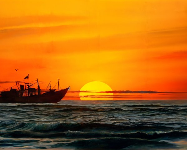 Sunset Over Ocean with Silhouetted Ship