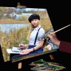 Hand Holding Paintbrush Over Canvas of Young Woman