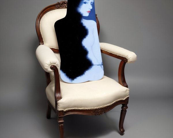 Elegant vintage chair with silhouette against blue background