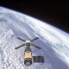 Abstract Artwork of Spacecraft Orbiting Colorful Planet