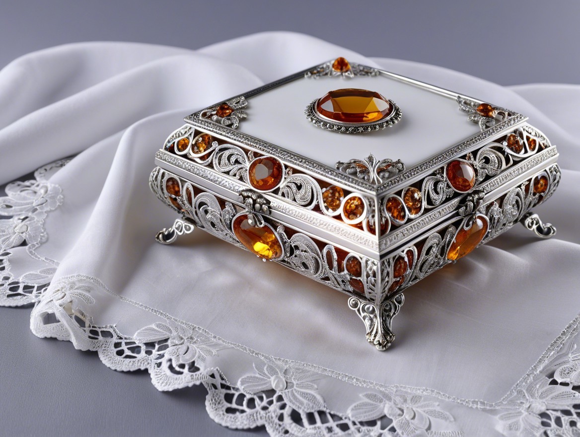 Ornate jewelry box with silver filigree and amber gems