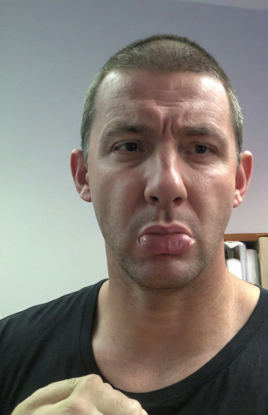 Close-up selfie of a man with fair skin and crew cut