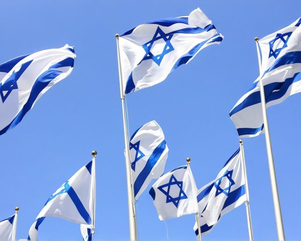 Israeli Flags Waving Against a Clear Blue Sky