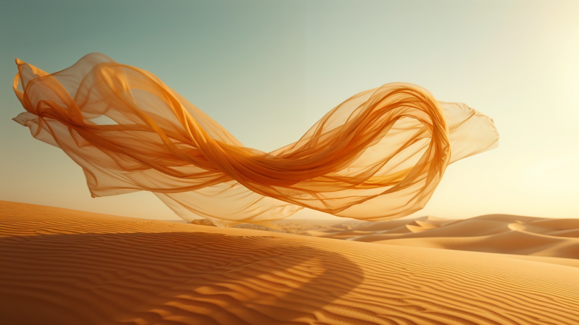 Delicate orange fabric contrasts with golden desert dunes