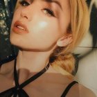 Close-up of a woman with flawless makeup and blond hair