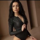 Stylish woman in fitted black shirt with wavy hair