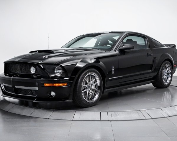 Sleek Black Sports Car with Muscular Design Features