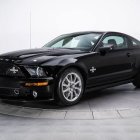 Sleek Black Sports Car with Muscular Design Features