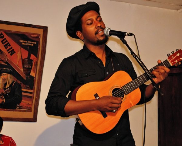Musician with Ukulele Performing in Intimate Setting