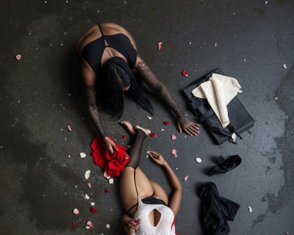 Contrasting Individuals on Dark Surface with Rose Petals
