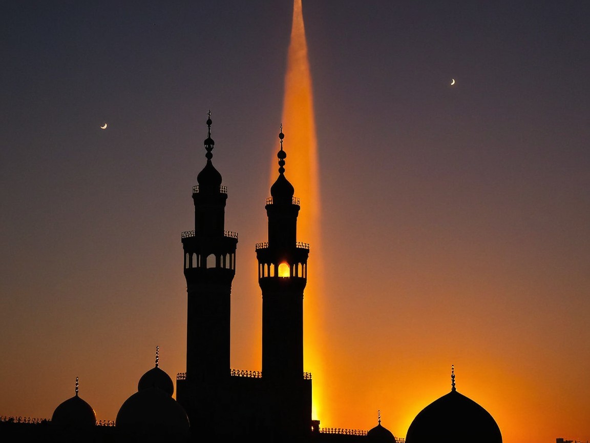 Silhouette of Mosque at Vibrant Sunset with Minarets