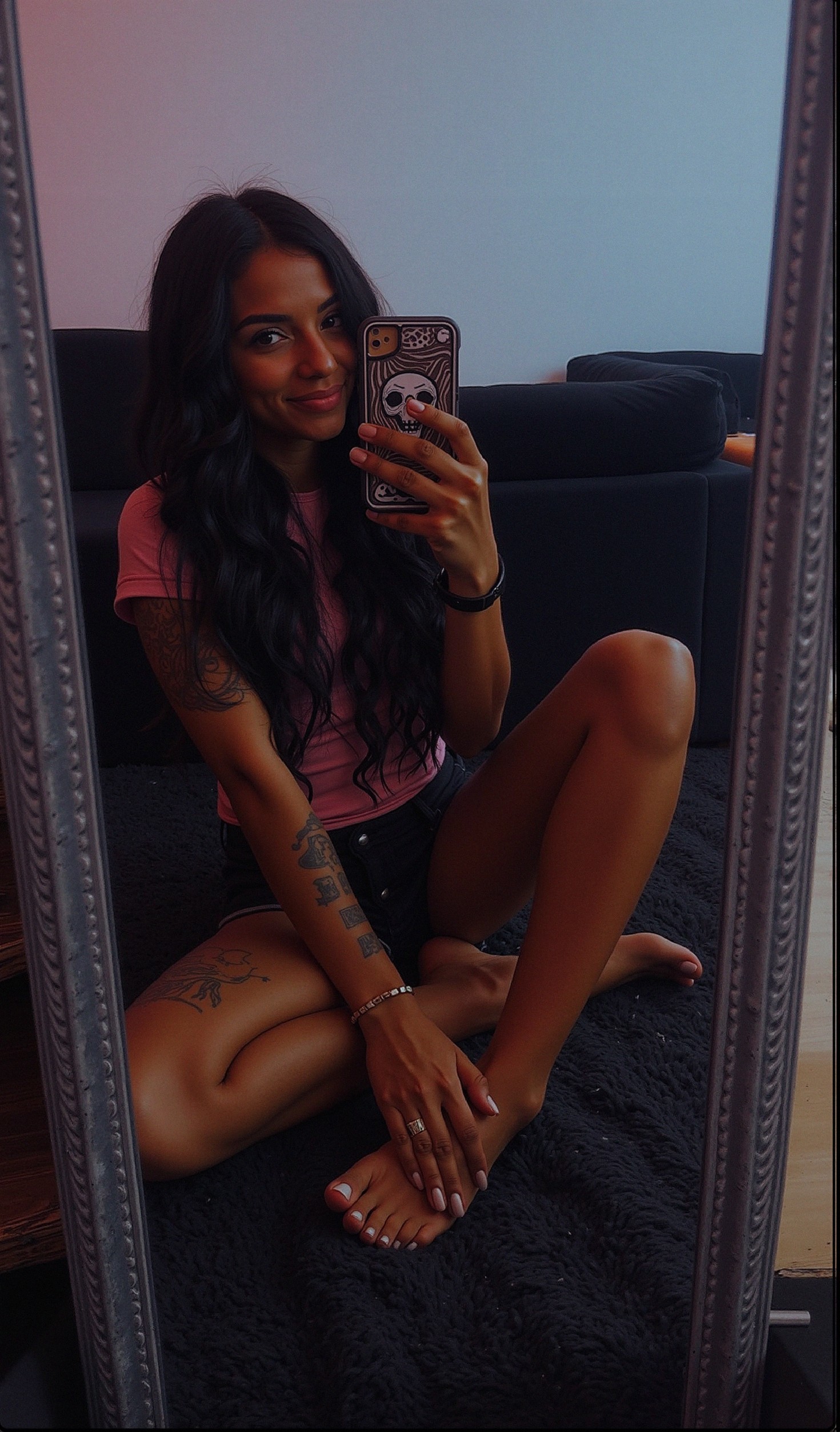 Young woman with tattoos in cozy living room setting