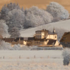 Serene Landscape with Quaint Houses and Rolling Hills