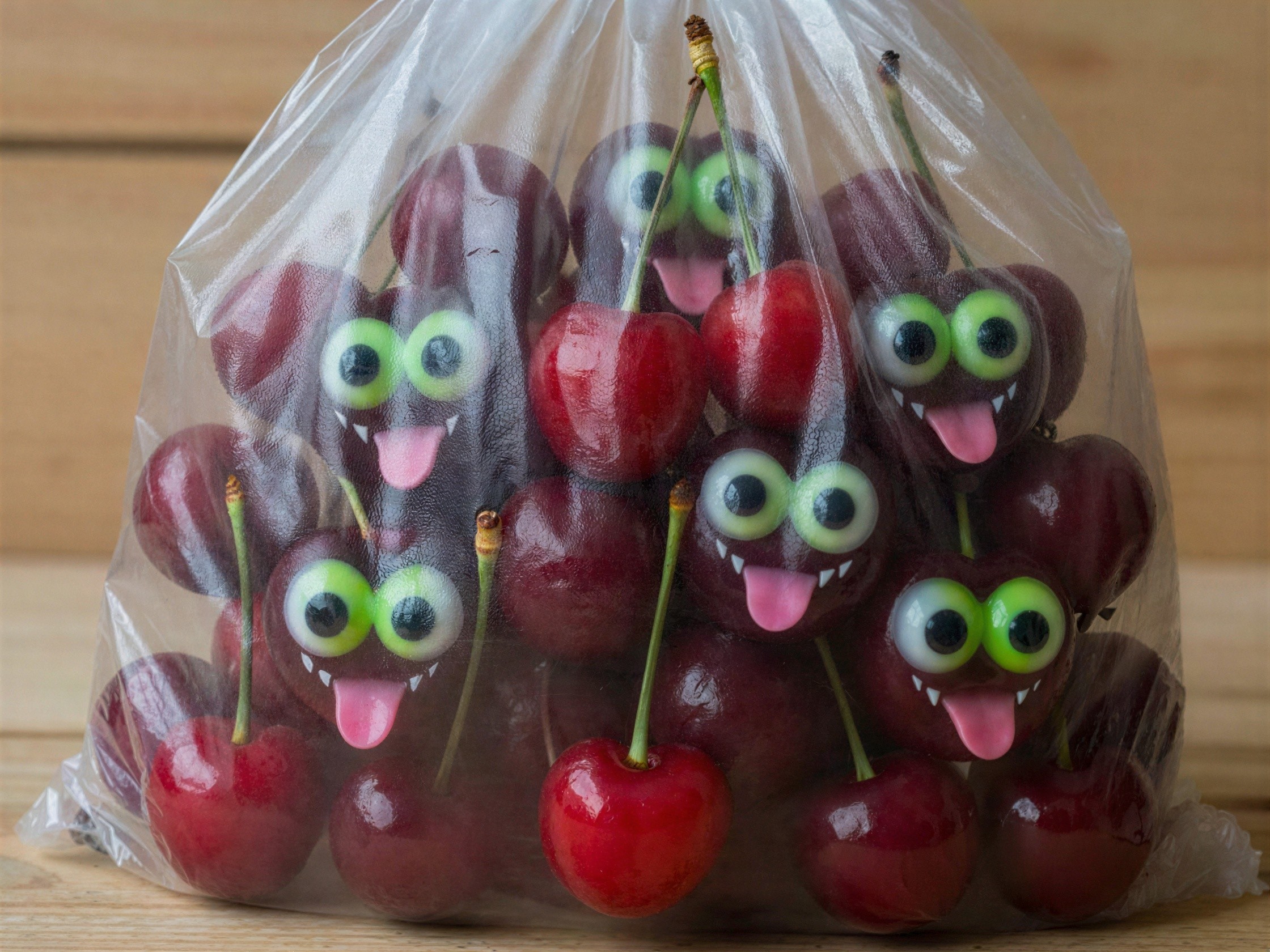 Cherries with Googly Eyes and Teeth in Plastic Bag