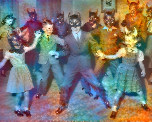Vintage Costumed Group with Devilish Masks in Colorful Haze