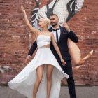 Couple in Formal Attire by Rustic Wall with Mural