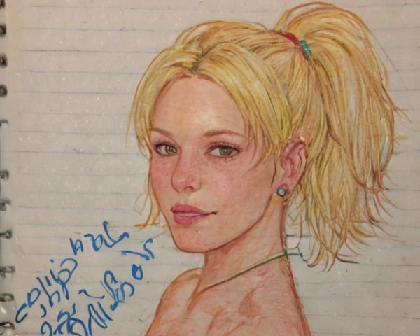 Hand-Drawn Portrait of Young Woman on Notebook Paper