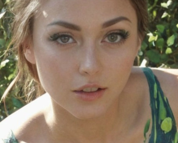 Close-Up Portrait of a Young Woman in Nature