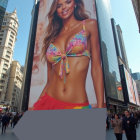 Billboard Displaying Rainbow Bikini in Urban Setting