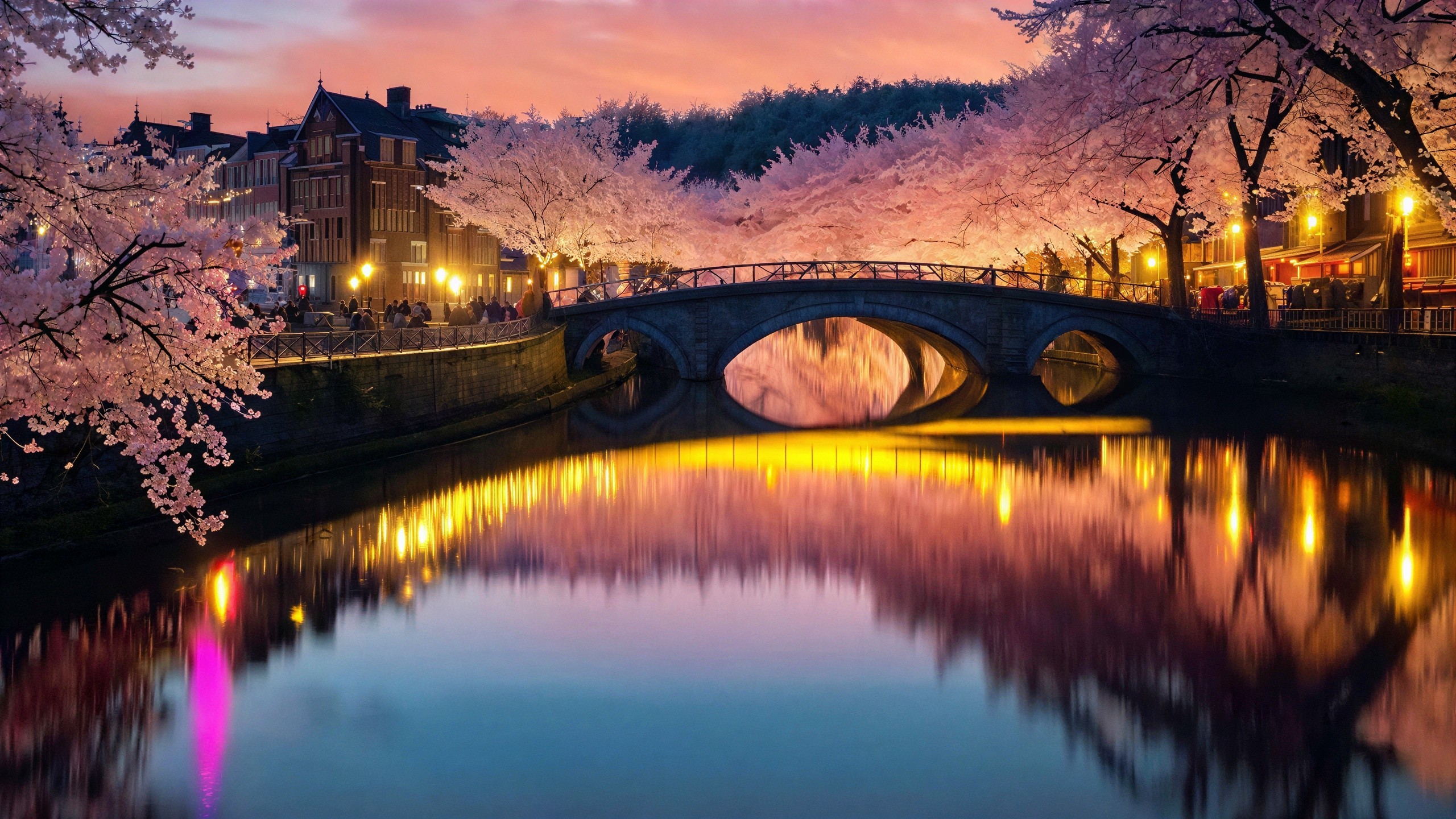 Vibrant Night Scene of a Canal City with Stone Bridge