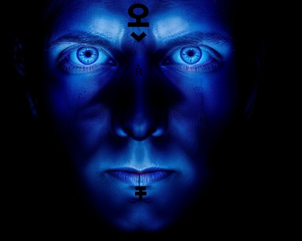 Close-Up Portrait with Blue Eyes and Dramatic Lighting