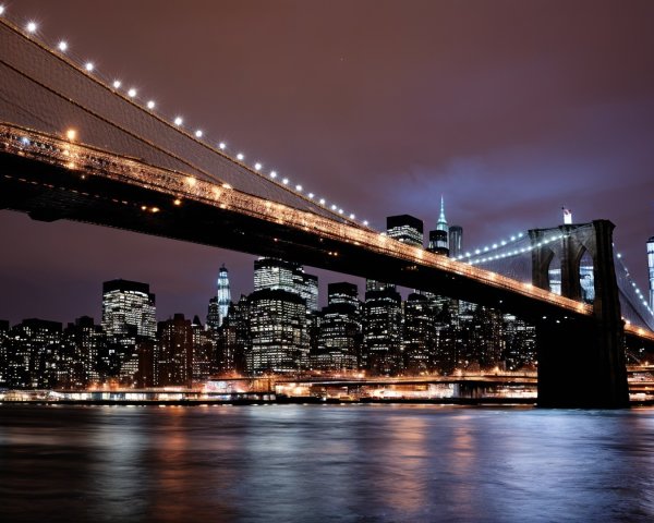 Brooklyn Bridge Night View with NYC Skyline and River