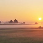 Tranquil Sunrise Landscape with River and Lush Hills