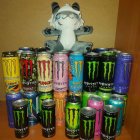 Plush Cat on Colorful Energy Drink Can Display