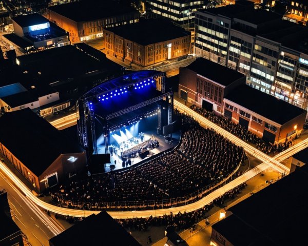 Vibrant Nighttime Concert Scene Over Urban Landscape