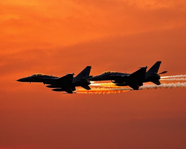 Fighter Jets in Formation Against Vibrant Sunset Sky